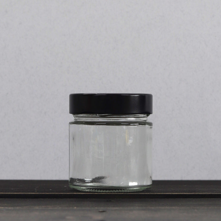 Glasburk med svart lock